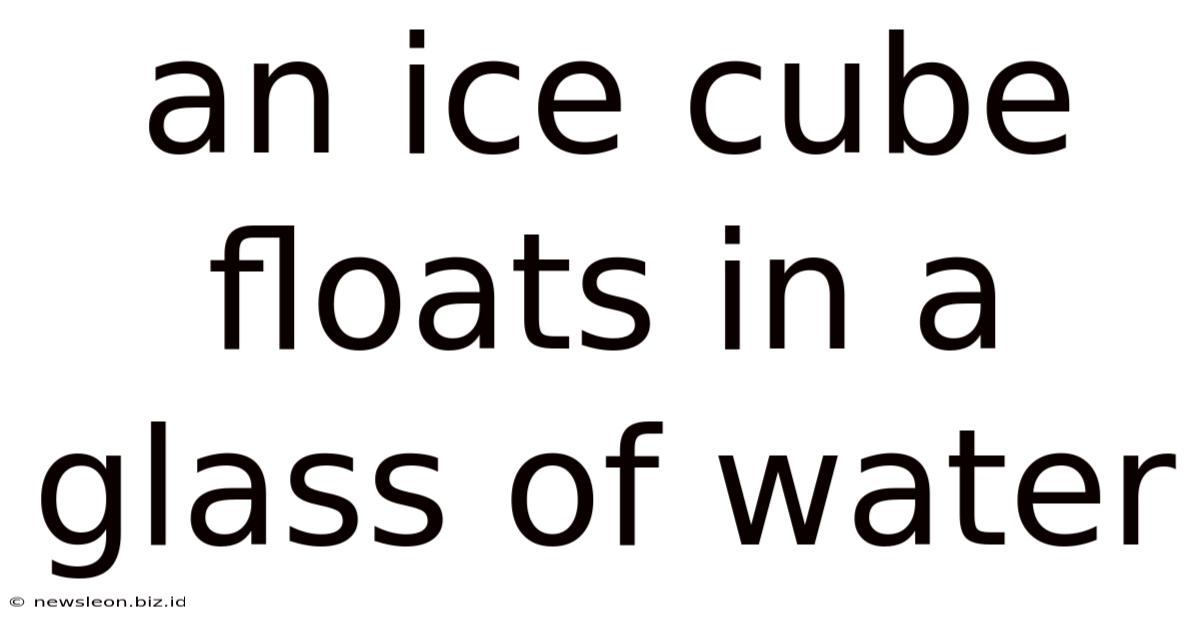 An Ice Cube Floats In A Glass Of Water